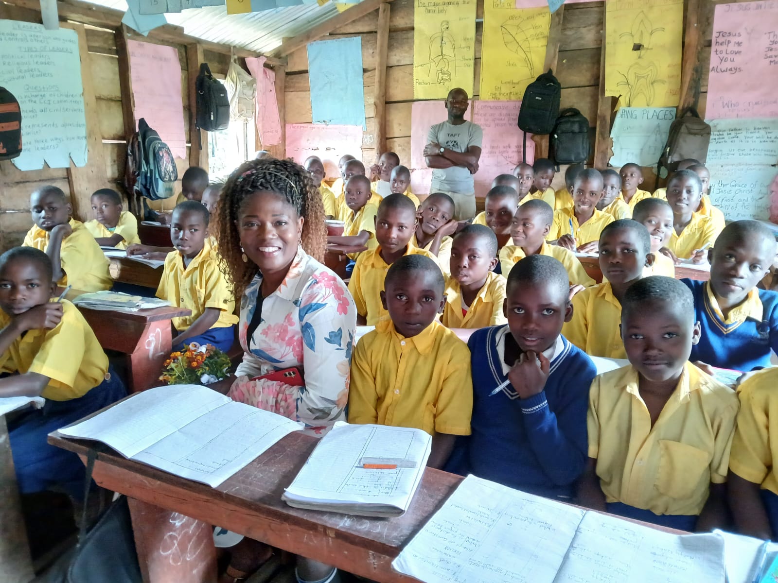 A full classroom at Nyantaboma, pupils at shared wooden desks